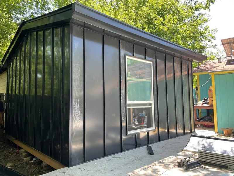 Black standing seam metal wall panels for Roof Inspection in Seven Oaks